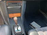 a car dashboard with a gear box and a steering wheel