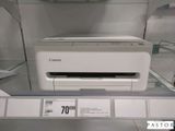 une photo d'une imprimante Canon exposée dans un magasin