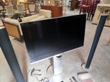 a television that is sitting on a stand in a store