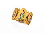 an image of a gold ring with a picture of a woman and a man