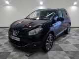 the black nissan qxv is parked on a checkered floor