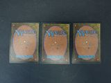 three magic the gathering booster cards