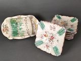 three pieces of porcelain dishes with floral designs on them