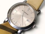 a picture of a watch with a yellow and black strap