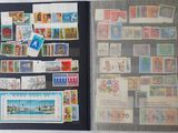 a book with stamps and stamps on it on a table