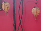 two lamps that are on a stand in a room