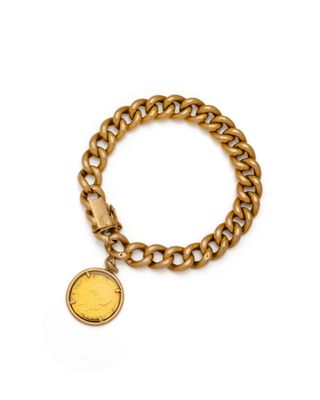 a gold chain bracelet with a coin charm