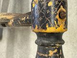 a close up of an old wooden handle on a chair