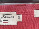 a picture of a label on a red shirt
