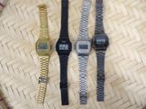 three watches sitting next to each other on a table