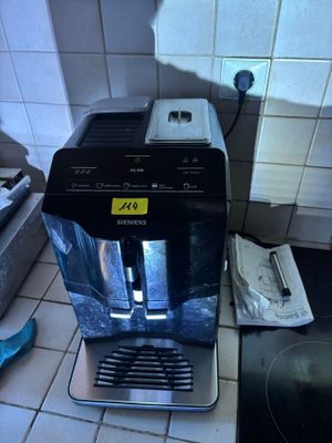 a coffee maker sitting on a counter in a kitchen