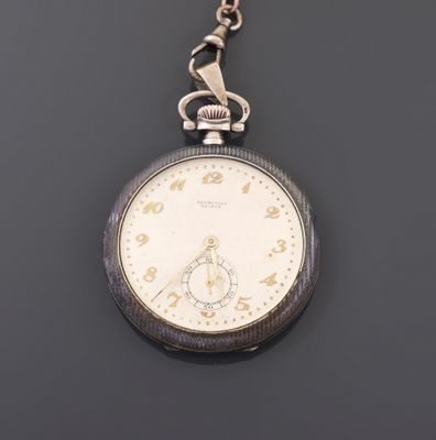 an antique pocket watch with a chain hanging from it ' s side