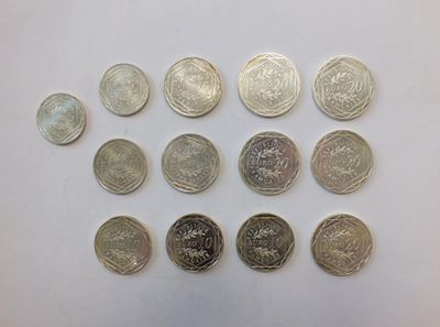 many different types of coins on the table