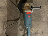a drill on the floor with a cord attached to it