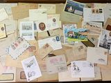 a suitcase full of letters and postcards on the floor