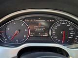 a close up of a car dashboard with various gauges