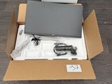 a box with a laptop in it sitting on the floor