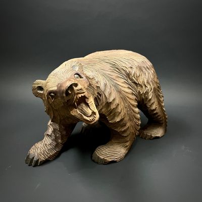 a statue of a bear that is on a table