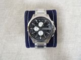 a watch that is sitting on top of a blue cloth
