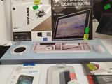 a table with a laptop and other electronics on it