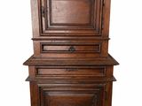 an old wooden cabinet with two drawers and a door on top