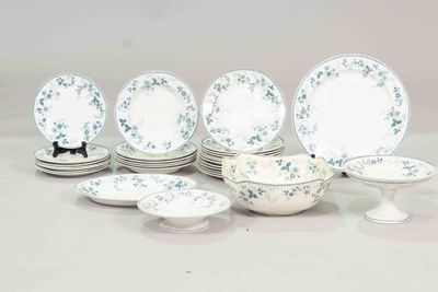 a lot of plates and bowls that are sitting on a table