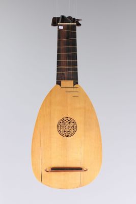 an old wooden instrument hanging from a ceiling