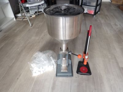 a machine that is sitting on the floor next to a bag