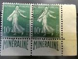 two stamps on a piece of paper with a picture of a woman holding a tennis racquet