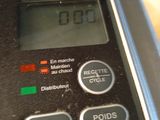 a close up of a clock on the side of a blender