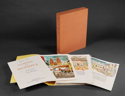 plusieurs livres sont empilés sur une table