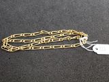 a close up of a chain with a tag attached to it