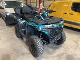 a picture of a blue atv parked in a garage