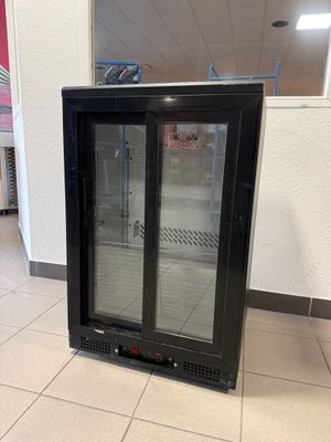 an image of a glass door refrigerator in a store