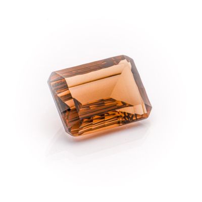 a square faceted brown diamond on a white background