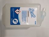 a bottle of hand sanitizer sitting on a white surface