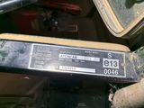 a close up of a car dashboard with a sticker on it