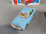 a blue toy car and a box on a table