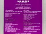 purple sign on a wall with information about the various types of wine