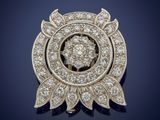 a diamond and gold broochle, by van cleef