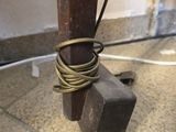a wooden pole with a bunch of wires attached to it