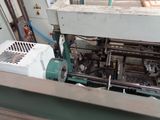 an image of a machine that is working on a piece of wood