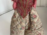 a small doll that is sitting on a table