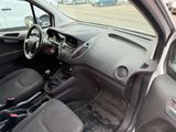 a car that is sitting in a parking lot with the door open