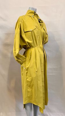 a yellow trench coat on a mannequin mannequin mannequin mannequin mannequin mannequin mannequin mannequin manne