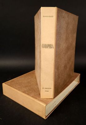 two books are stacked on top of each other on a table
