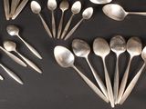 a lot of spoons and spoon spoons on the table