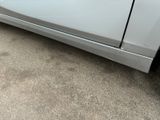 a car that has a dent in the side of it