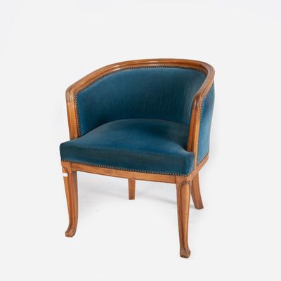 a blue chair with a wooden frame on a white background