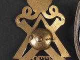 two badges that are on a black surface